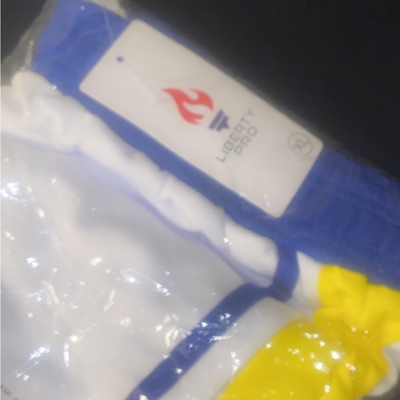 I’m selling these shorts that are white with Blue and yellows stripes. - Picture 2 of 2